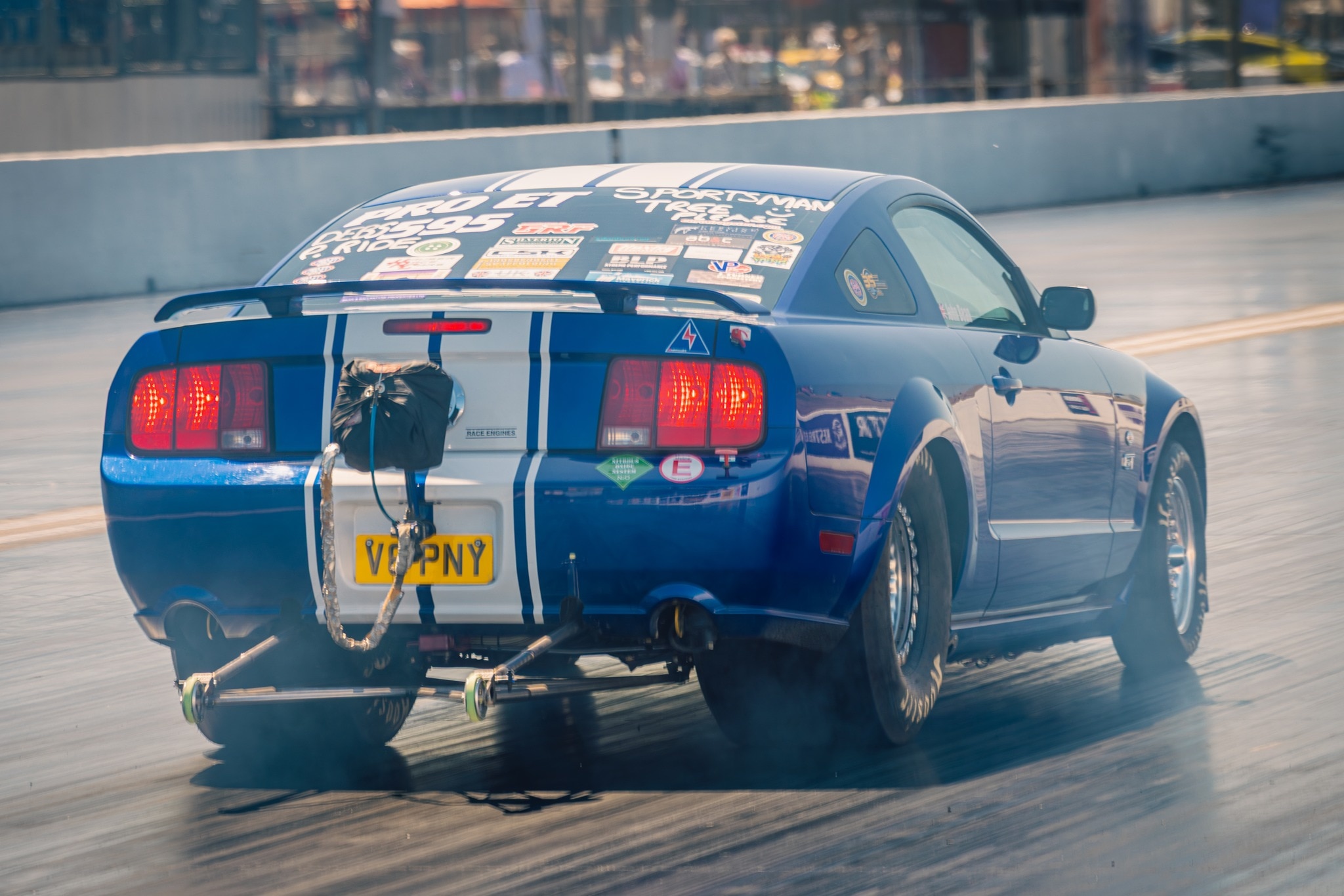 John Bean's Mustang performing nitrous-powered drag demos on the strip. License valid for earned editorial, press releases, press kits. All non-broadcast digital and online media Region: Global. This content is solely for editorial use and for providing individual users with information. Any storage in databases, or any distribution to third parties within the scope of commercial use, or for commercial use is permitted with written consent from Ford in Europe GmbH only. Photo credit: Tom Woodward